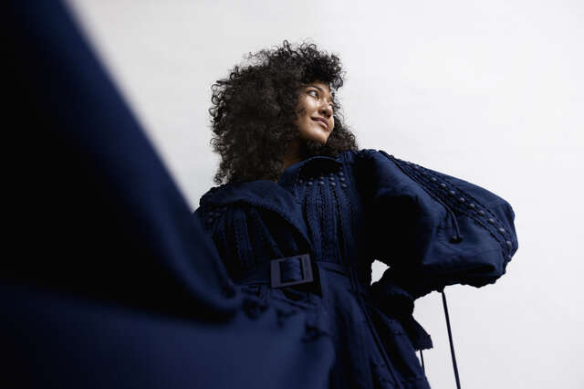 Dark blue frill dress worn by a model