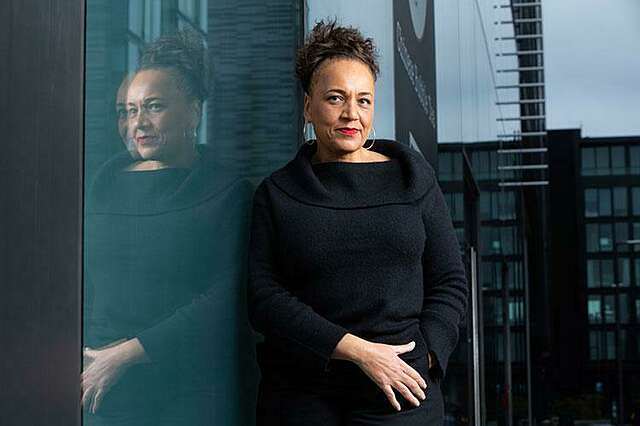 A woman is looking at the camera