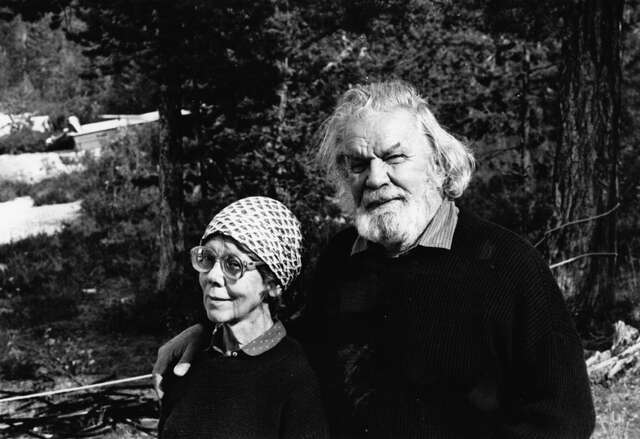 A woman with a scarf and a bearded man.