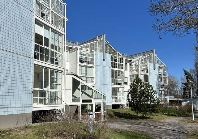 Apartment building facades with glass balconies