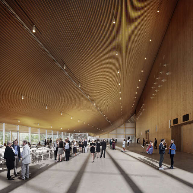 The view shows a large lobby with a vaulted ceiling. There are a lot of people in the space.